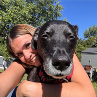 Photo of Marissa holding dog